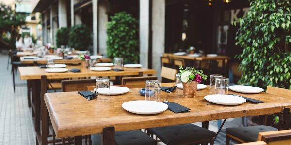 Dish on the wooden table in outdoor restaurant